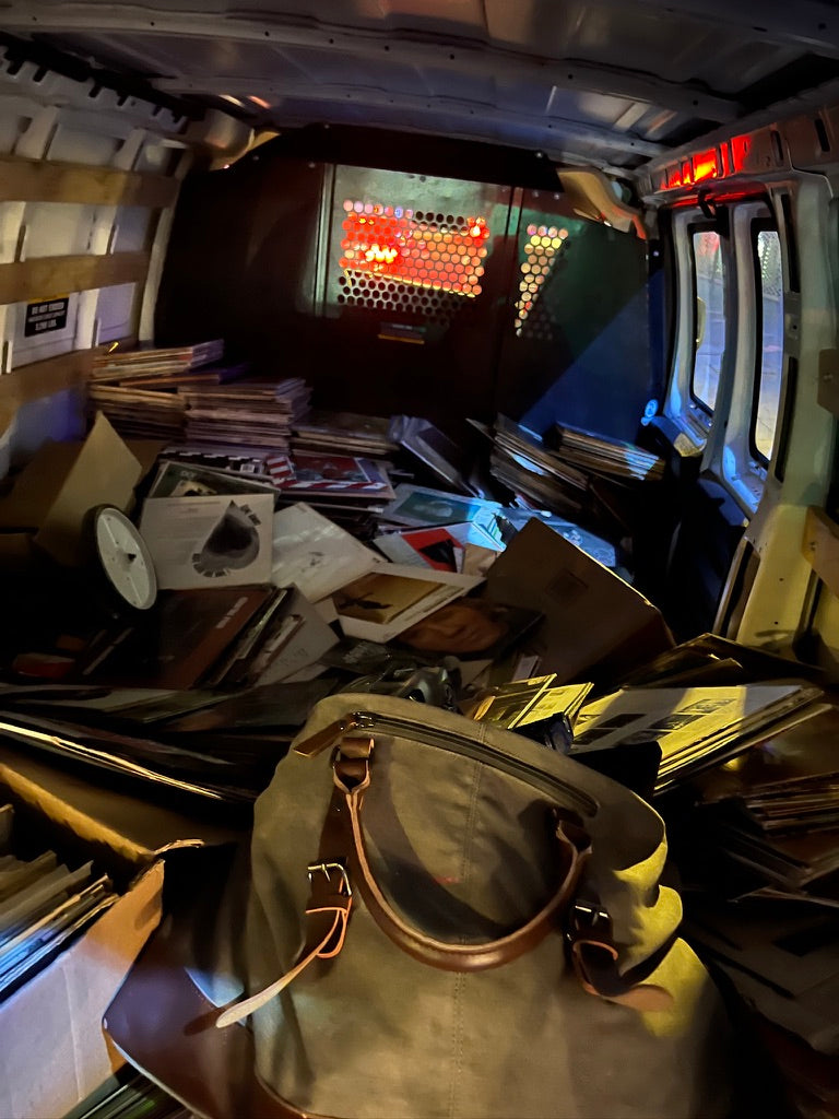 Van packed with crates and boxes of records
